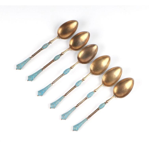 688 - A set of six continental silver gilt and enamel teaspoons, 75g (6).