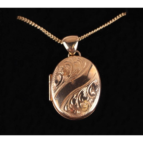 718A - A 9ct gold locket on a 9ct gold chain. 9.9g