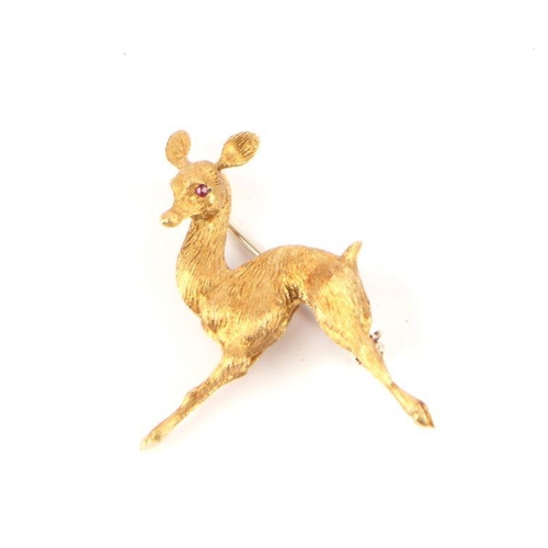 721 - An Italian 18ct gold brooch modelled as a deer with ruby eyes, 9g.