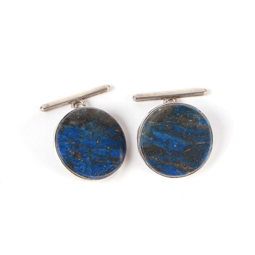 727 - A pair of gentleman's lapis lazuli cufflinks set in silver coloured metal mounts.