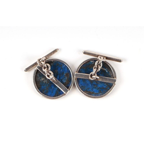 727 - A pair of gentleman's lapis lazuli cufflinks set in silver coloured metal mounts.