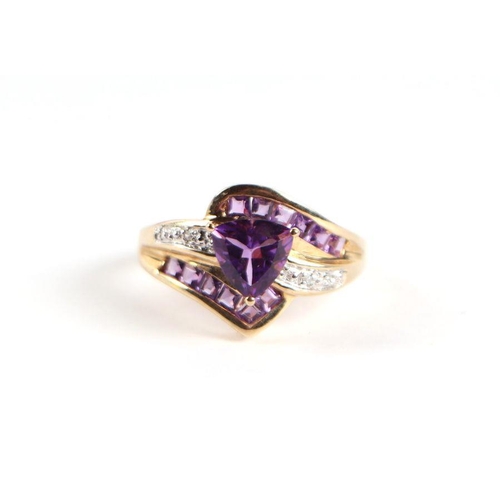 729 - A 9ct gold amethyst and diamond crossover ring with central heart shaped stone, approx UK size 'N', ... 