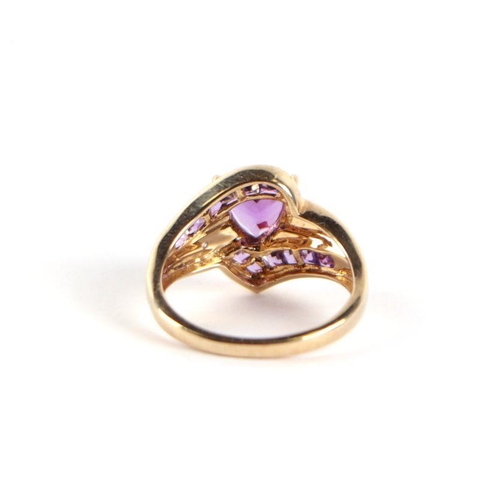 729 - A 9ct gold amethyst and diamond crossover ring with central heart shaped stone, approx UK size 'N', ... 