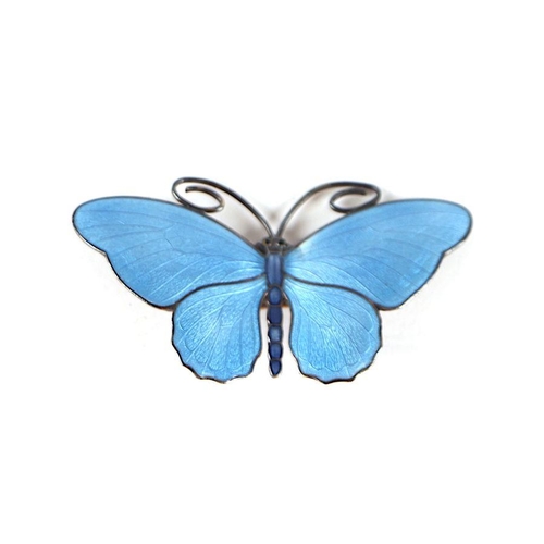 736 - Magnus Aase (Norwegian) - a blue enamel and silver butterfly brooch, 6cm wide.