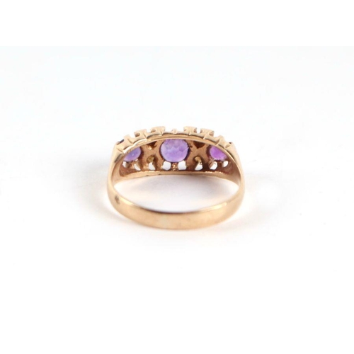 739 - A 9ct gold three stone amethyst and seed pearl half hoop ring, approx UK size 'M', 2g.