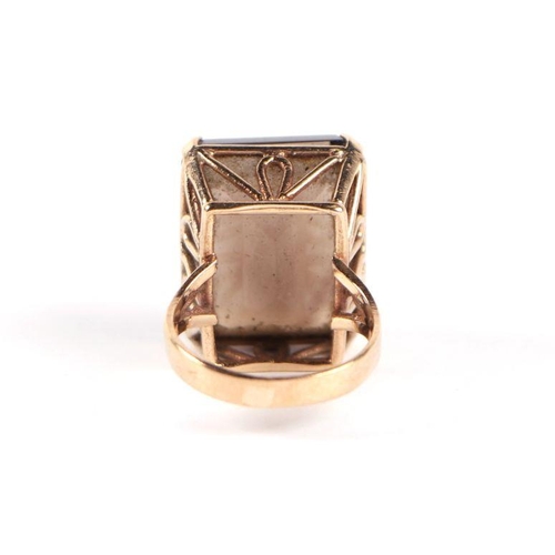 741 - A 9ct gold and emerald cut smoky quartz dress ring, approx UK size 'J', 9g.