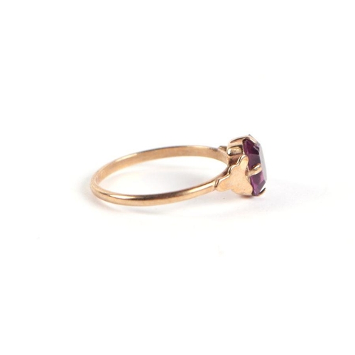 744 - A 9ct gold and amethyst solitaire ring, approx UK size 'P', 1g.