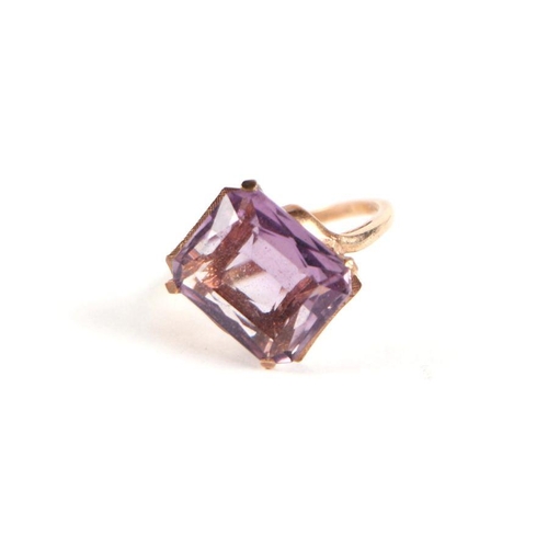 745 - A 9ct gold and emerald cut amethyst solitaire ring, approx UK size 'P', 5g.