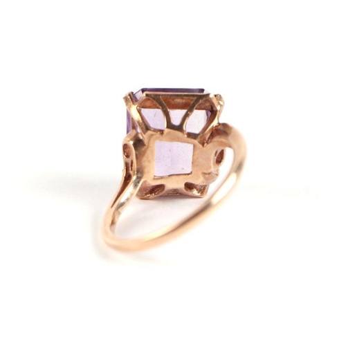 745 - A 9ct gold and emerald cut amethyst solitaire ring, approx UK size 'P', 5g.