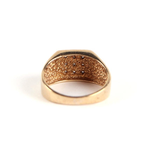 746 - A 9ct gold and diamond gentleman's signet ring, approx UK size 'N', 4g.