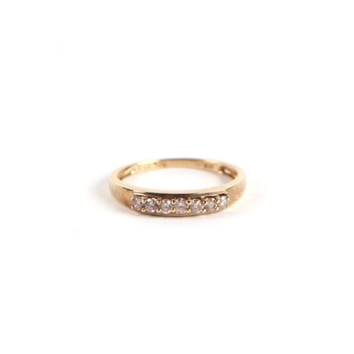 748 - A 9ct gold and diamond half hoop ring, approx UK size 'N', 2g.