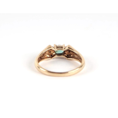 750 - A 9ct gold green stone and diamond bow tie form dress ring, approx UK size 'N', 3g.