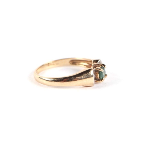 750 - A 9ct gold green stone and diamond bow tie form dress ring, approx UK size 'N', 3g.