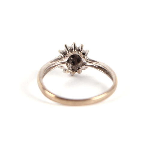 752 - A 9ct white gold and diamond flower head cluster ring, approx UK size 'L', 2g.