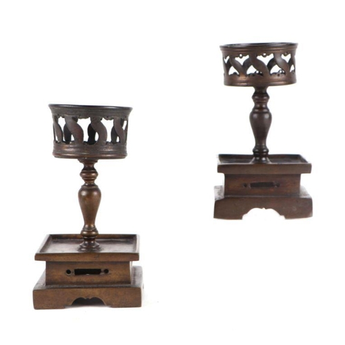 754 - A pair of Chinese bronze stands having baluster columns on square stepped bases. 18cm high (2)