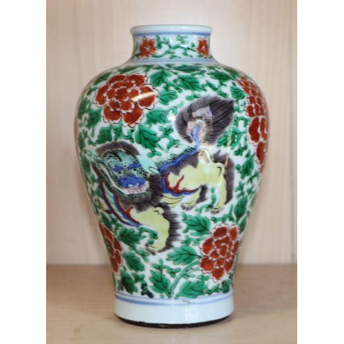 757 - A Chinese famille verte baluster vase decorated with shishi and prunus, 19cms highCondition ReportGo... 