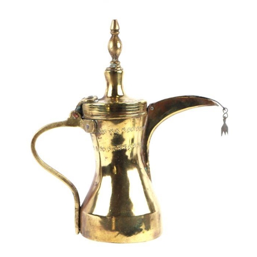 767 - A Turkish / Islamic brass dallah coffee pot, 29cms high.