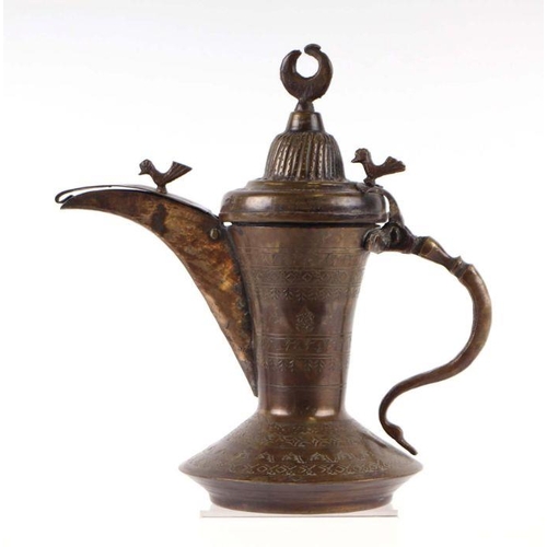 769 - A Turkish / Islamic brass dallah coffee pot, 24cms high.