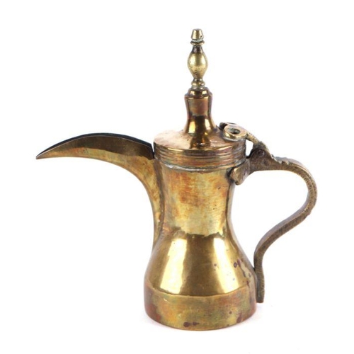 771 - A Turkish / Islamic brass dallah coffee pot. 22cm high