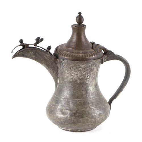 772 - A Turkish / Islamic tinned copper dallah coffee pot. 22cm high