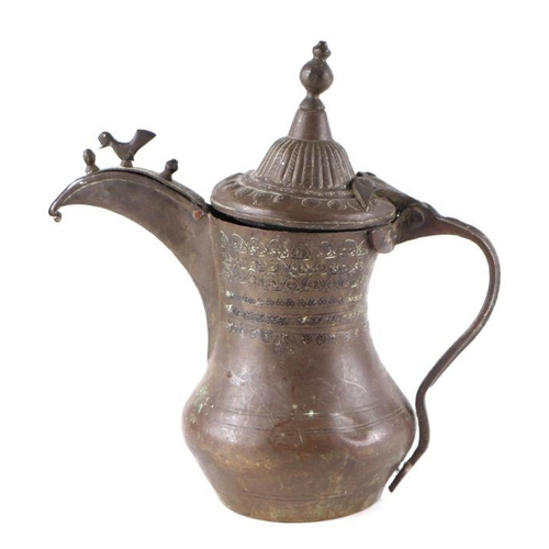 773 - A Turkish / Islamic brass dallah coffee pot. 22cm high