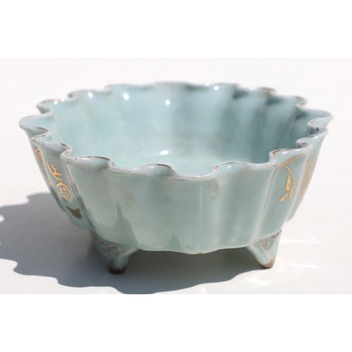 785 - A Chinese pale celadon glaze oval footed planter with wavy rim, gilt decoration and calligraphy, 21c... 