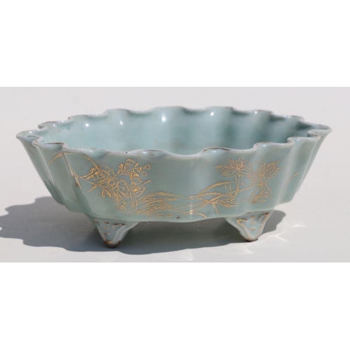 785 - A Chinese pale celadon glaze oval footed planter with wavy rim, gilt decoration and calligraphy, 21c... 