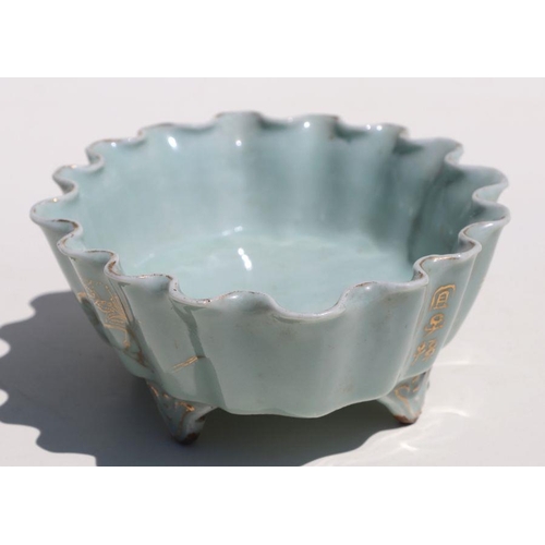 785 - A Chinese pale celadon glaze oval footed planter with wavy rim, gilt decoration and calligraphy, 21c... 