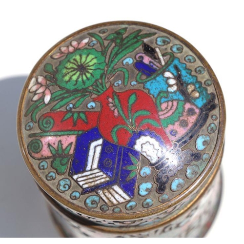 787 - A Chinese cloisonne box and cover of cylindrical form decorated with precious objects, 9.5cms high.