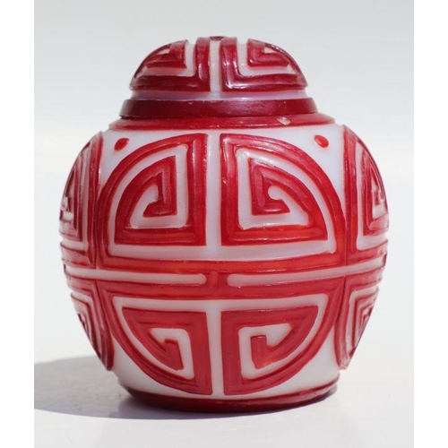 788 - A Chinese red overlay Peking glass ginger jar and cover, 15cms high.