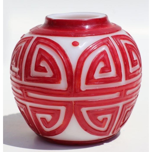 788 - A Chinese red overlay Peking glass ginger jar and cover, 15cms high.