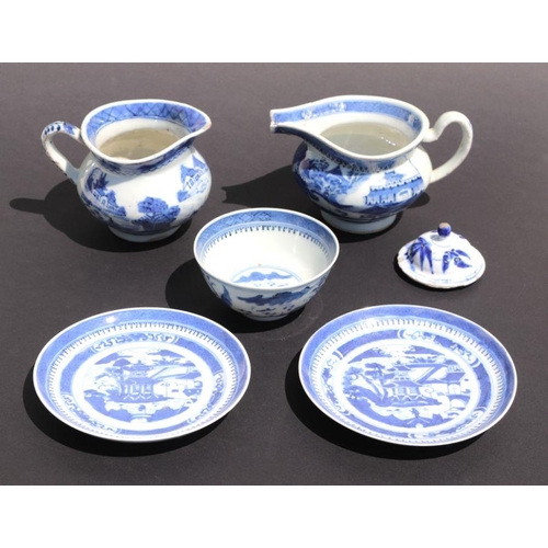 792 - A pair of Chinese blue & white shallow dishes decorated with a pagoda, 15cms diameter; together ... 