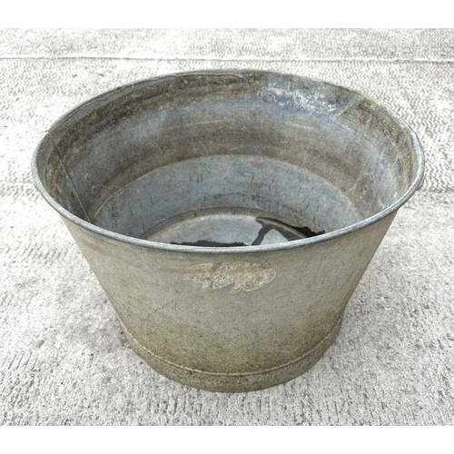 8 - A large two-handled galvanised metal pail or washtub, 53cm diameter.