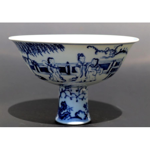 807 - A Chinese blue and white stem cup decorated with figures within a garden scene, 17cm diameter