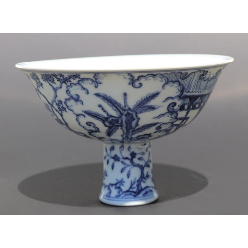 807 - A Chinese blue and white stem cup decorated with figures within a garden scene, 17cm diameter