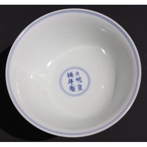 807 - A Chinese blue and white stem cup decorated with figures within a garden scene, 17cm diameter