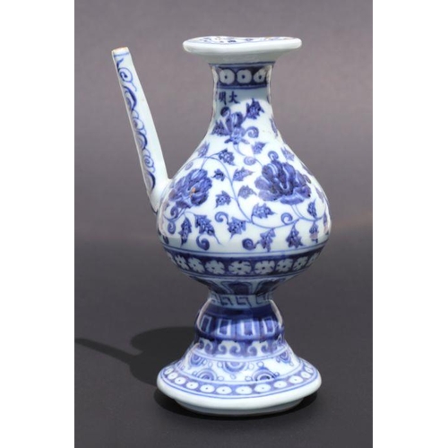 809 - A Chinese blue and white wine or sake ewer decorated with scrolling foliage and cut flowers, 20cm hi... 