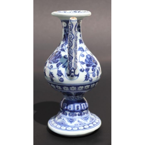 809 - A Chinese blue and white wine or sake ewer decorated with scrolling foliage and cut flowers, 20cm hi... 