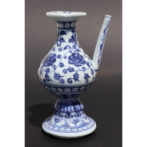 809 - A Chinese blue and white wine or sake ewer decorated with scrolling foliage and cut flowers, 20cm hi... 