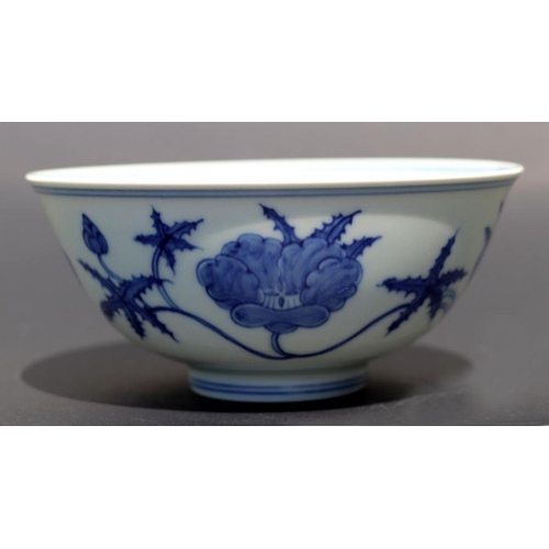 812 - A Chinese blue and white footed bowl decorated with scrolling flowers, six character mark to base, 1... 