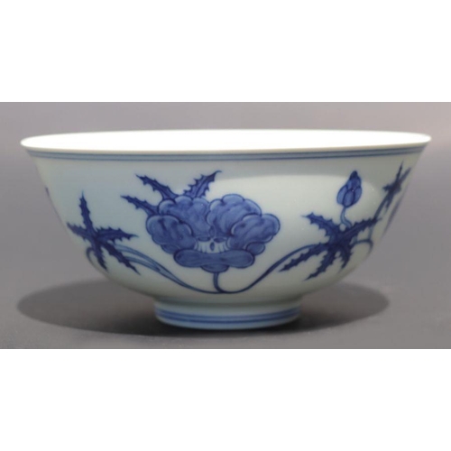 812 - A Chinese blue and white footed bowl decorated with scrolling flowers, six character mark to base, 1... 