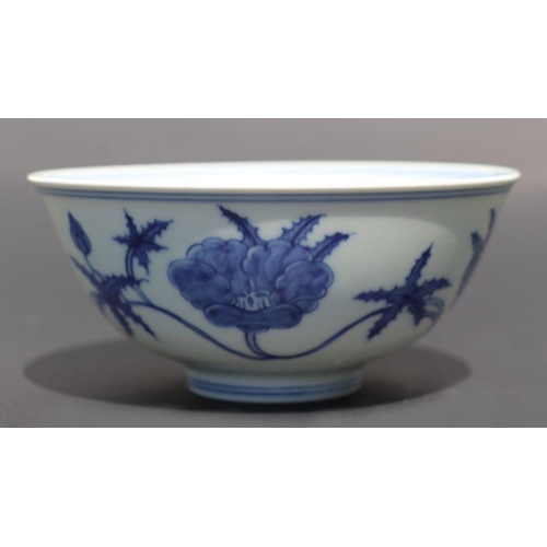 812 - A Chinese blue and white footed bowl decorated with scrolling flowers, six character mark to base, 1... 