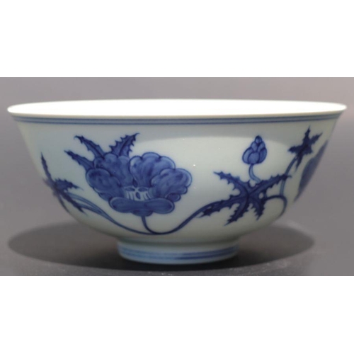 812 - A Chinese blue and white footed bowl decorated with scrolling flowers, six character mark to base, 1... 