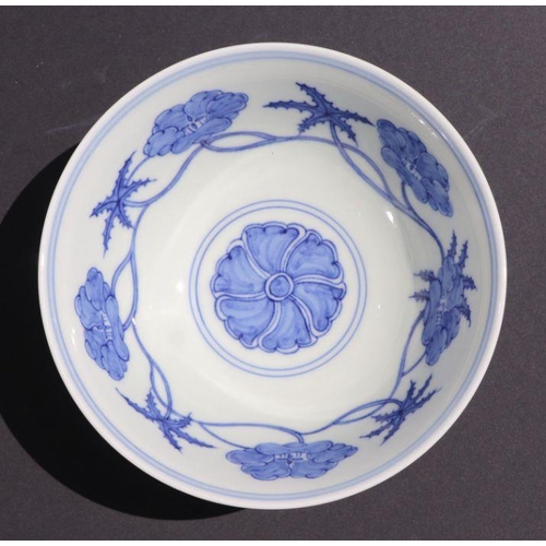 812 - A Chinese blue and white footed bowl decorated with scrolling flowers, six character mark to base, 1... 