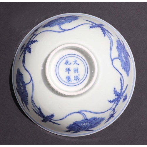 812 - A Chinese blue and white footed bowl decorated with scrolling flowers, six character mark to base, 1... 