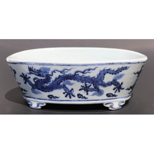 813 - A Chinese blue and white planter, decorated dragon chasing flaming pearl, six character mark to base... 