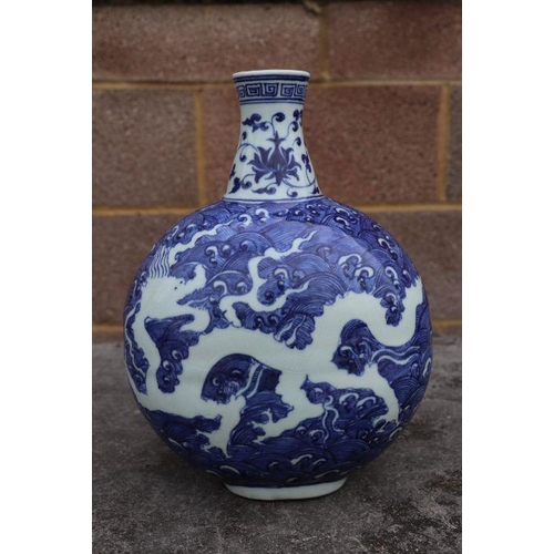 814 - A Chinese blue & white vase decorated with dragons amongst waves, four character mark to side, 2... 