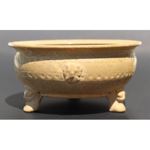 815 - A Chinese monochrome brown glaze tripod footed bowl with incised decoration, 20cm diameter.