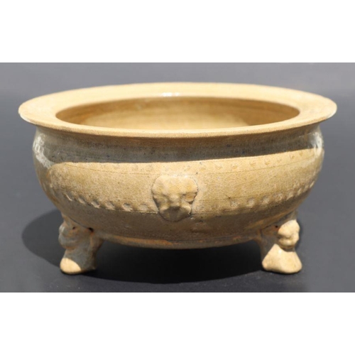 815 - A Chinese monochrome brown glaze tripod footed bowl with incised decoration, 20cm diameter.