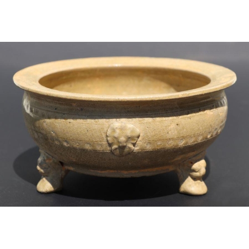 815 - A Chinese monochrome brown glaze tripod footed bowl with incised decoration, 20cm diameter.